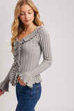 V-NECK RUFFLE TRIM RIBBED KNIT TOP